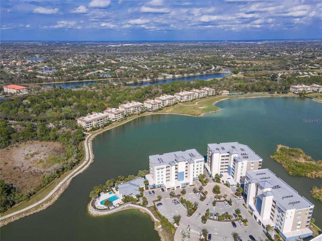 10520 Boardwalk Loop, Unit 302 Bradenton, FL 34202 - Photo 42 of 45 a view of a city with a lake
