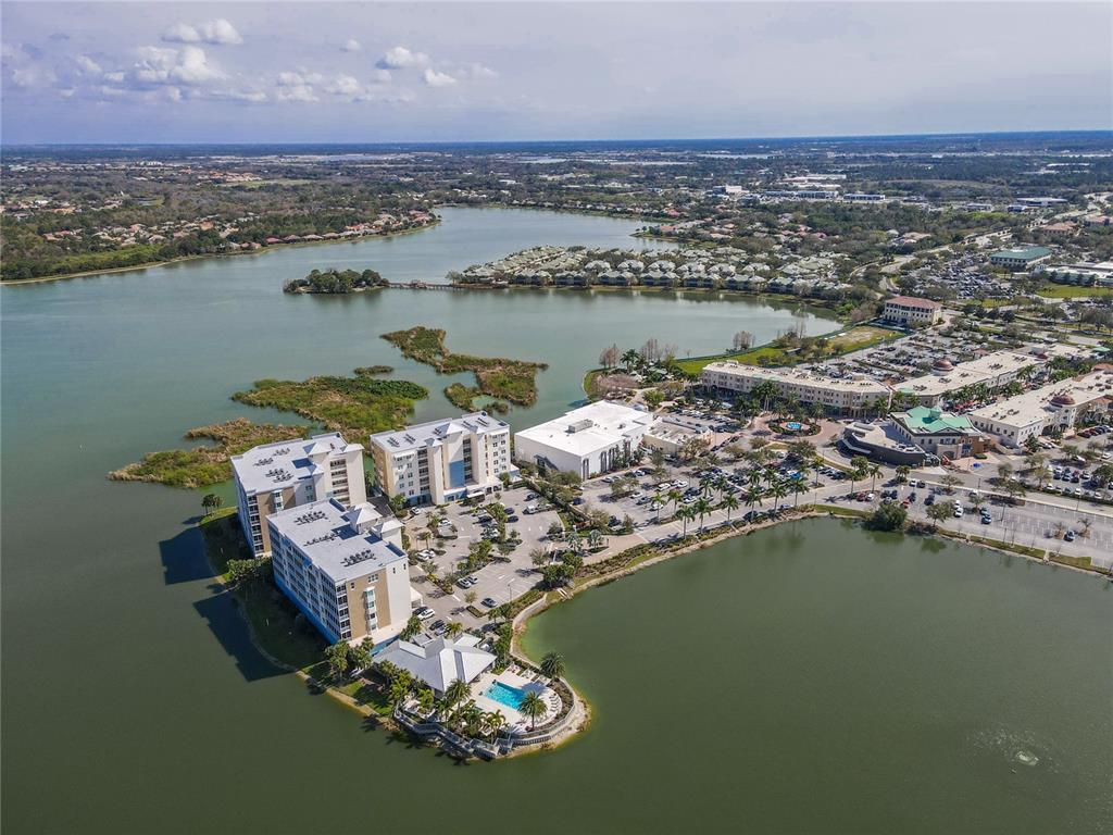 10520 Boardwalk Loop, Unit 302 Bradenton, FL 34202 - Photo 43 of 45 an aerial view of a house with a lake view