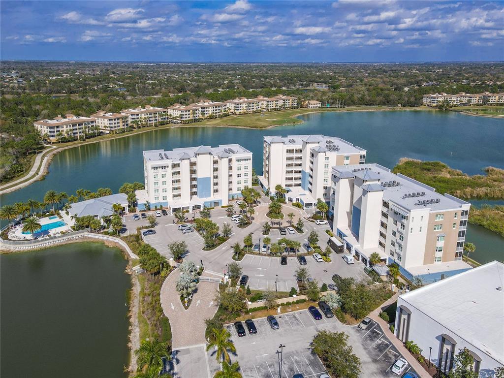 10520 Boardwalk Loop, Unit 302 Bradenton, FL 34202 - Photo 45 of 45 an aerial view of a city with lake view