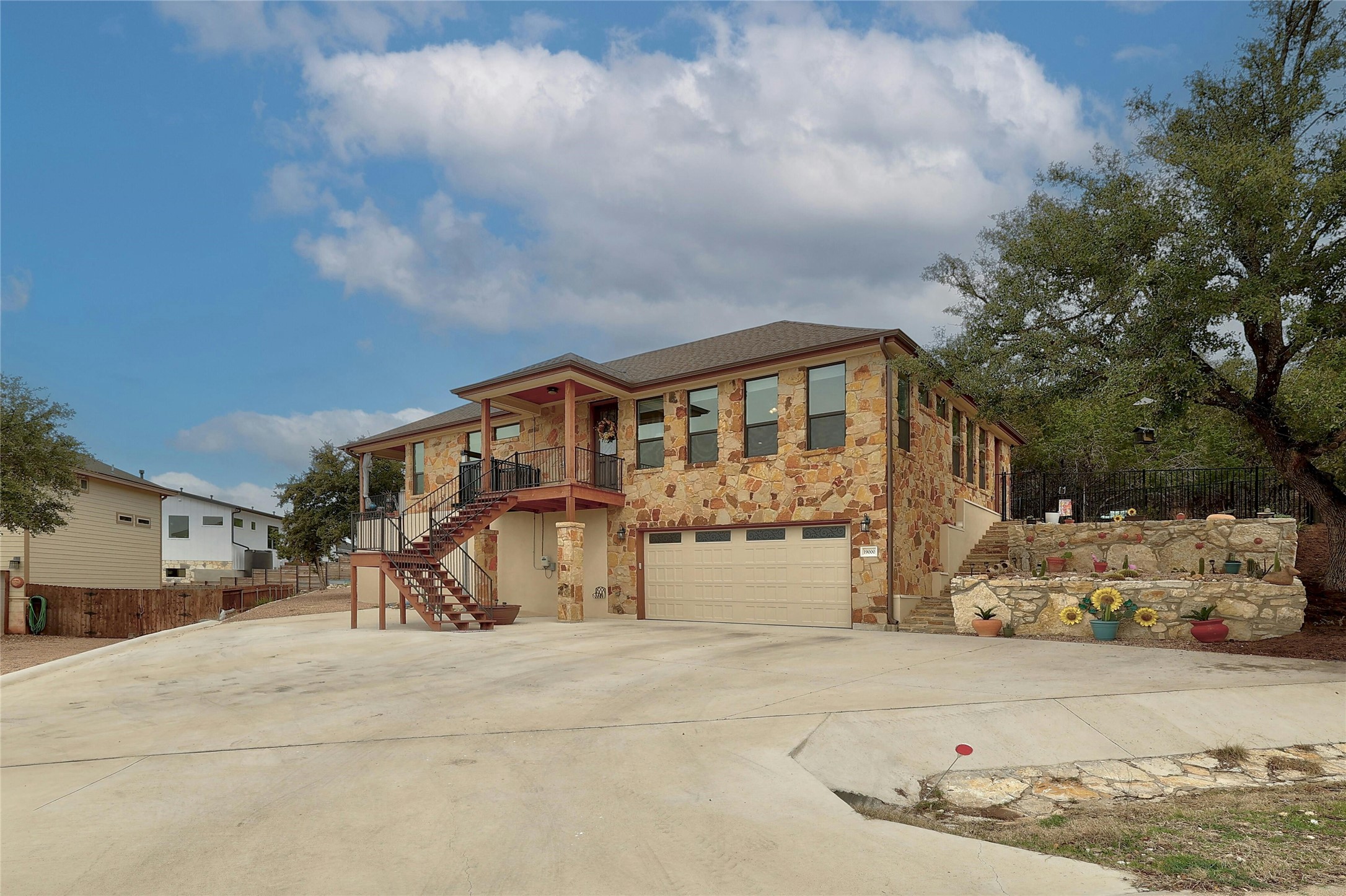 19000 Mariners Point Jonestown, TX 78645 - Photo 1 of 1 a front view of a house with a yard