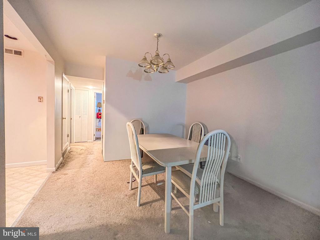 10843 Academy Road Philadelphia, PA 19154 - Photo 13 of 44 a view of a dining room with furniture and chandelier