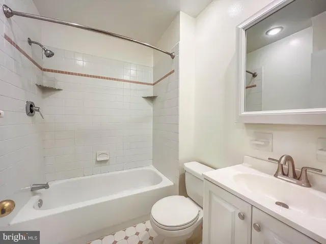 a bathroom with a sink a toilet and a bathtub