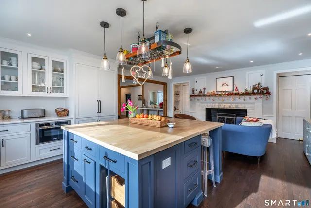 a view of living room kitchen island and wooden floor