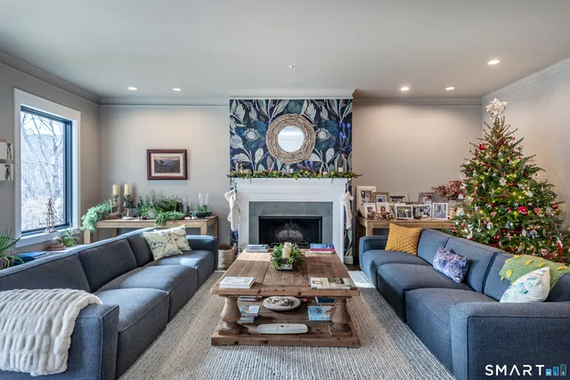 a living room with furniture and a fireplace