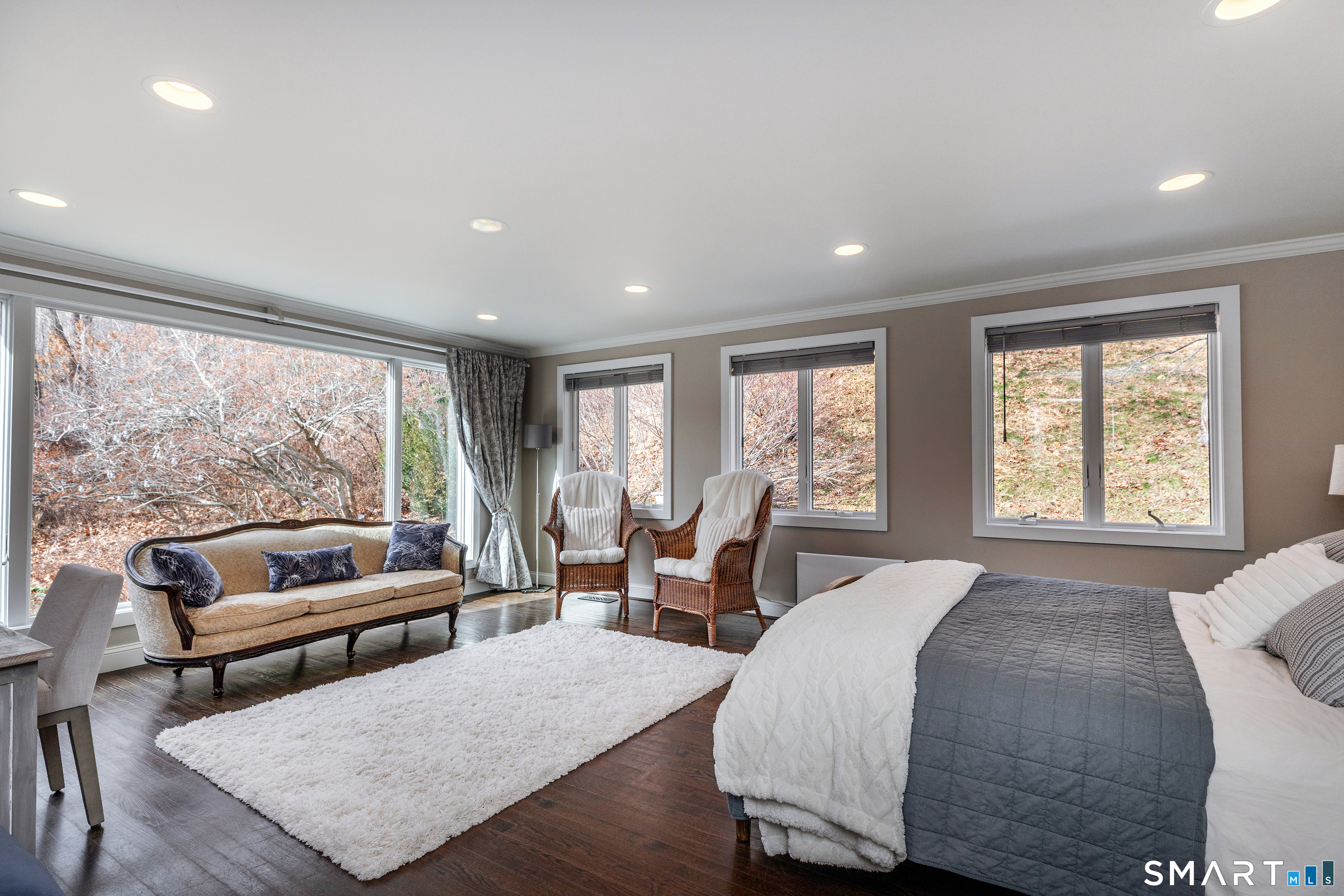 1030 Washington-Woodbury Road Roxbury, CT 06783 - Photo 24 of 40 a spacious bedroom with a bed a couch and a large window