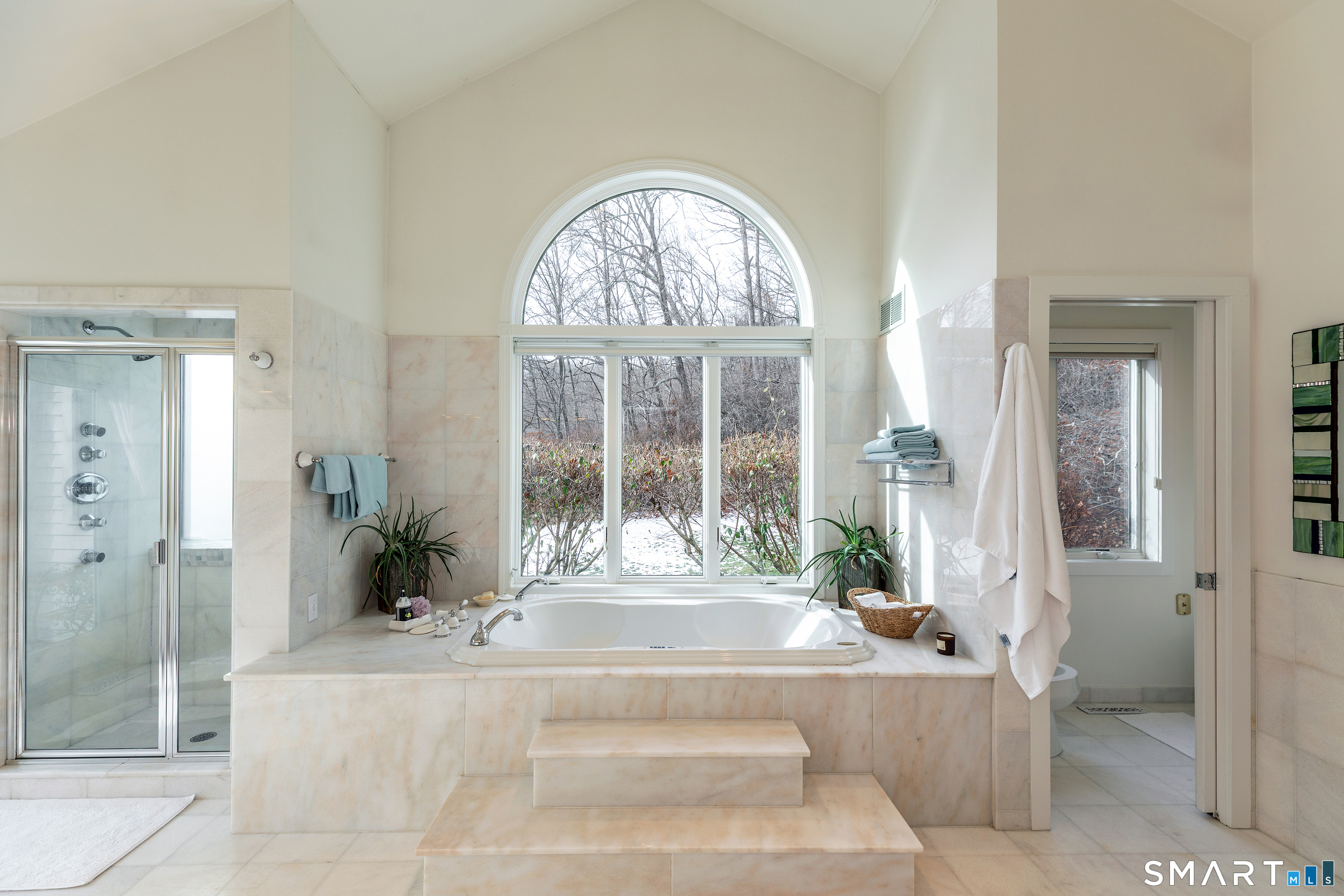 1030 Washington-Woodbury Road Roxbury, CT 06783 - Photo 32 of 40 a living room with a large window and a chandelier