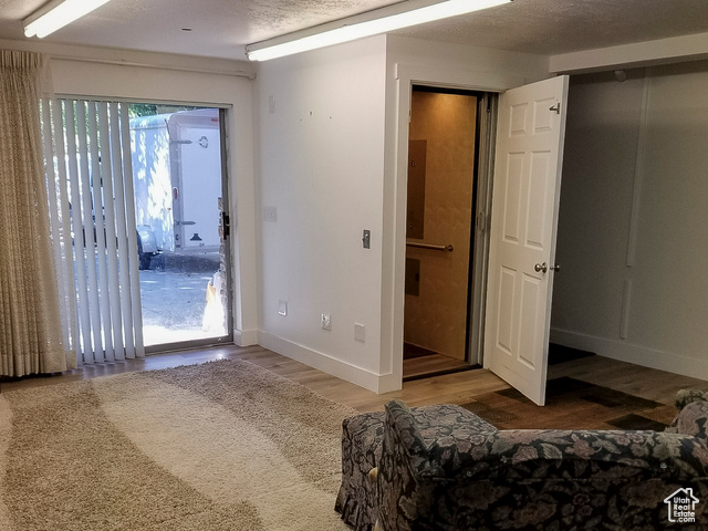 2855 South 1000 West Perry, UT 84302 - Photo 60 of 142 This unfurnished room features hardwood floors and access to the outdoors.