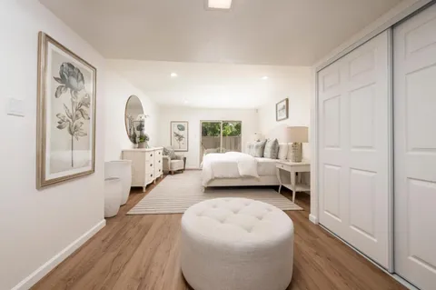a bathroom with a double vanity sink a toilet and a mirror