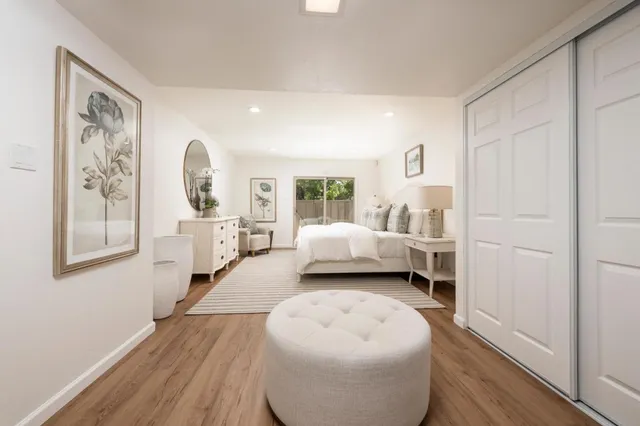 a bathroom with a double vanity sink a toilet and a mirror
