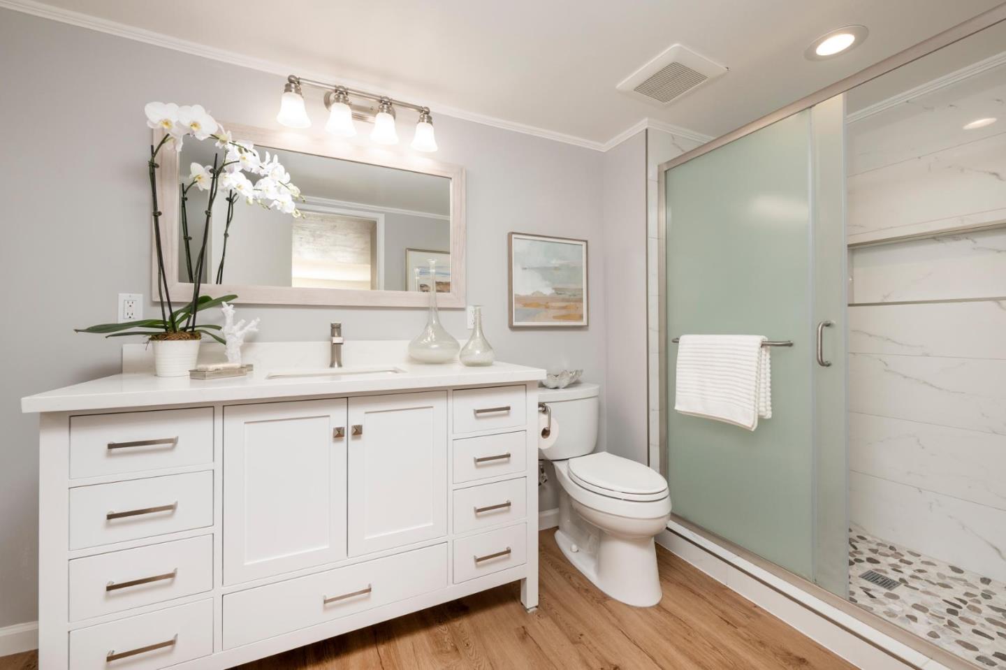 38 Weepingridge Court San Mateo, CA 94402 - Photo 13 of 25 a bathroom with a double vanity sink a toilet and a mirror