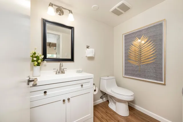 a view of a patio with couches table and chairs and potted plants