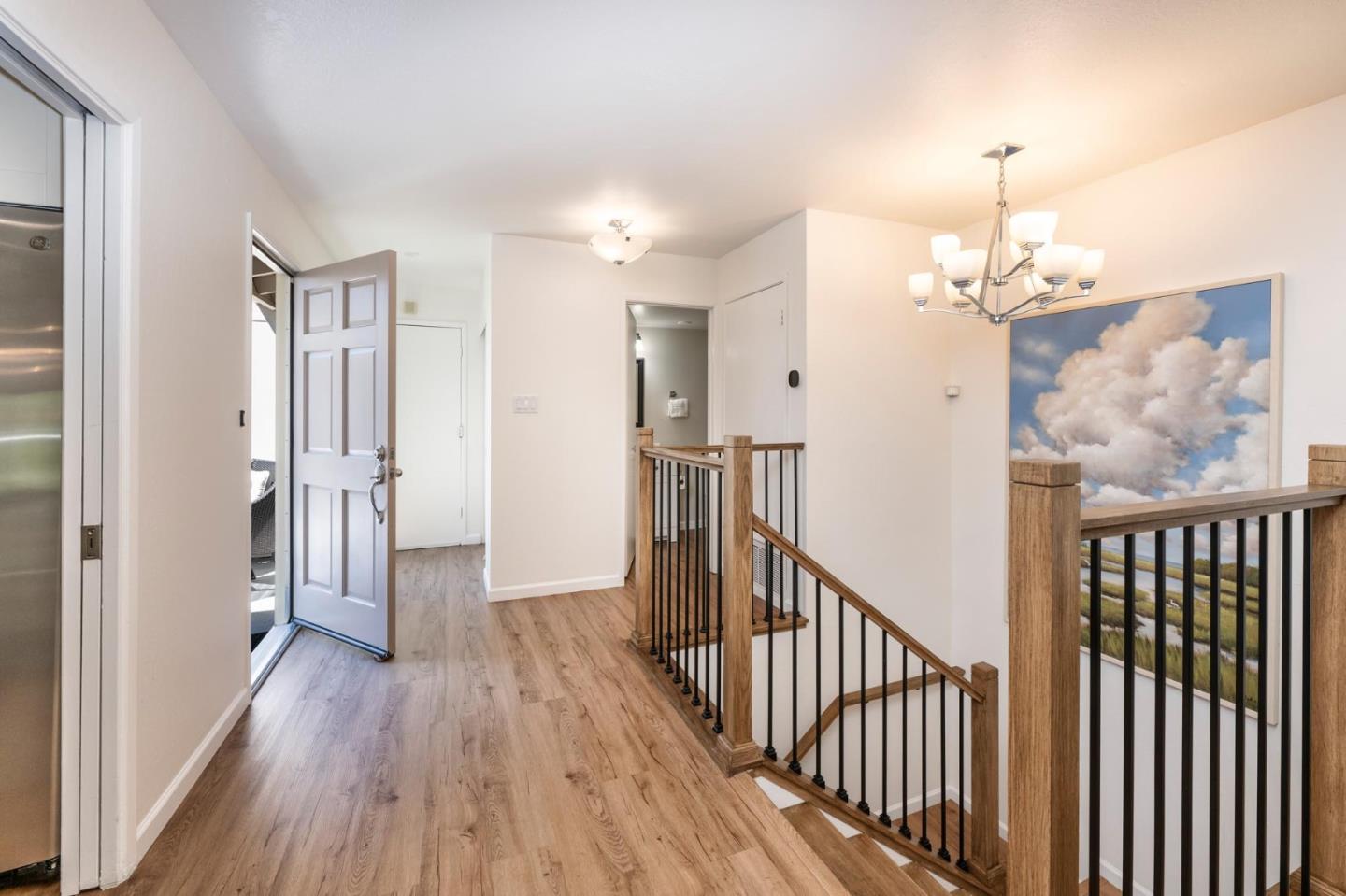 38 Weepingridge Court San Mateo, CA 94402 - Photo 9 of 25 a view of a hallway view with wooden floor and staircase