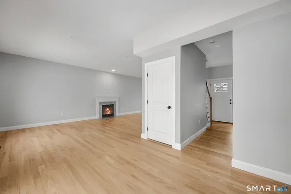 a kitchen with sink cabinets and wooden floor