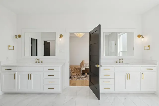 a bathroom with a sink vanity and mirror