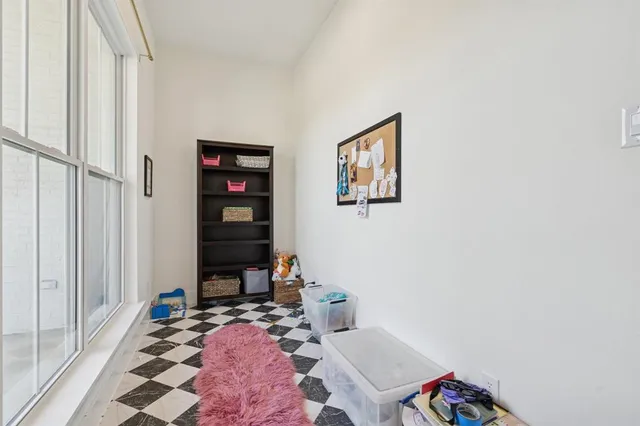 a bed room with a bed and a window