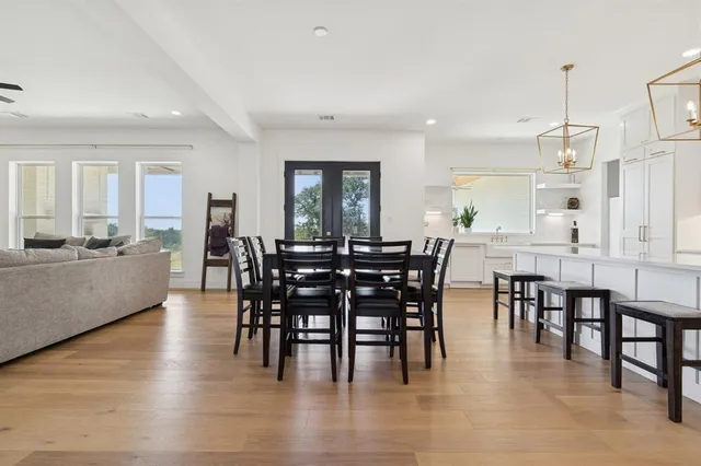 a view of a dining room and livingroom with lots of furniture