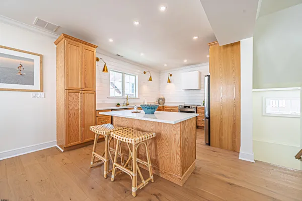 a kitchen with a table and chairs in it