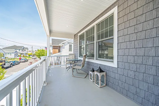 a view of balcony with furniture