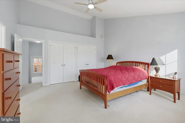 a bedroom with a bed and a cabinets