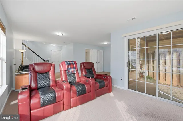 a bedroom with furniture and a potted plant