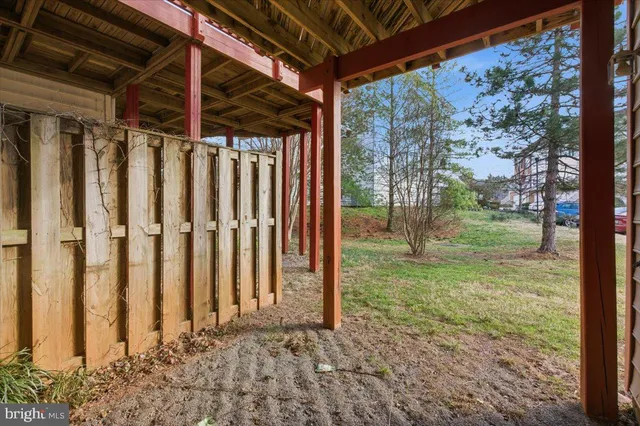a view of a backyard with pathway