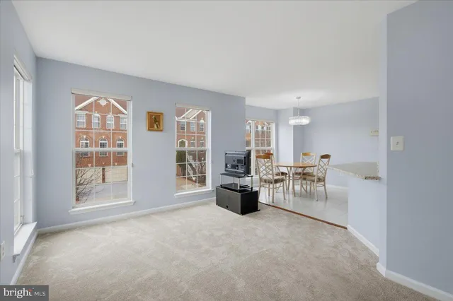 a view of a livingroom with furniture and a window