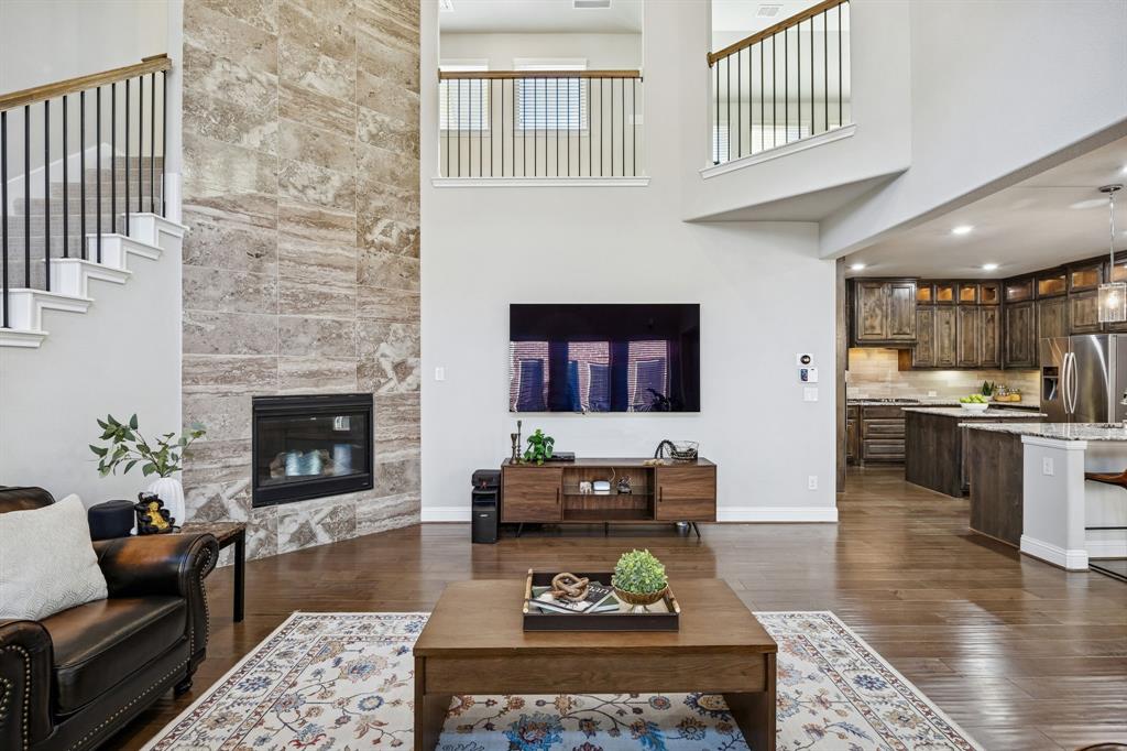 6333 Hall Road Frisco, TX 75034 - Photo 6 of 36 Floor to ceiling fireplace in living room.