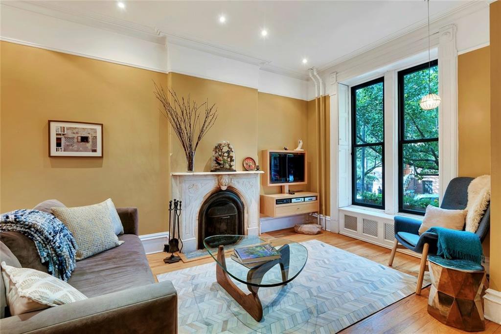 368 5th Street Brooklyn, NY 11215 - Photo 1 of 15 a living room with furniture and a fireplace