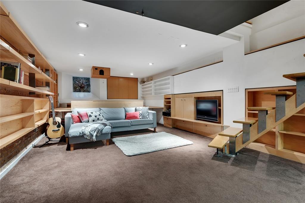 368 5th Street Brooklyn, NY 11215 - Photo 14 of 15 a living room with furniture and a flat screen tv