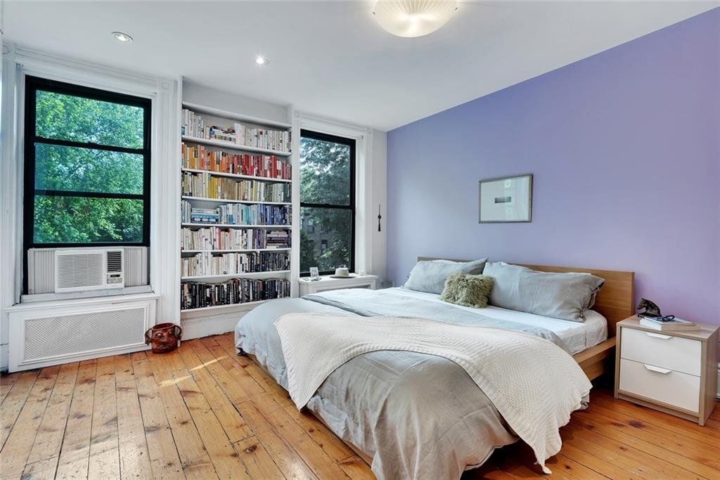 368 5th Street Brooklyn, NY 11215 - Photo 5 of 15 a spacious bedroom with a bed a dresser and a large window
