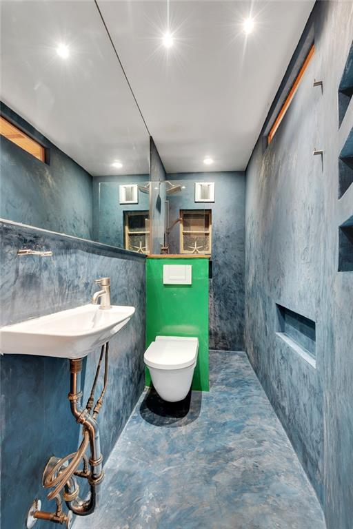368 5th Street Brooklyn, NY 11215 - Photo 9 of 15 a bathroom with a sink a toilet and a mirror
