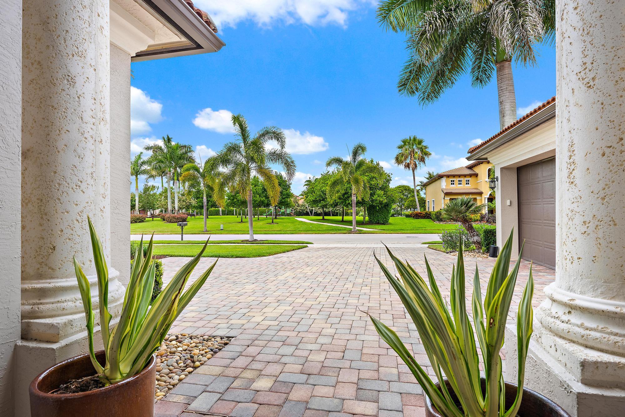 283 Rudder Cay Way Jupiter, FL 33458 - Photo 19 of 41 a view of a swimming pool with a yard