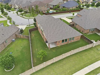 an aerial view of a house with swimming pool