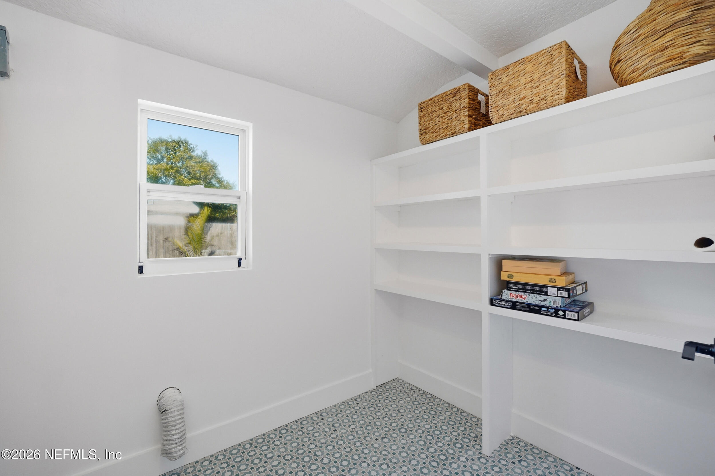 785 Triton Road Atlantic Beach, FL 32233 - Photo 18 of 54 a white house with a sink and a window