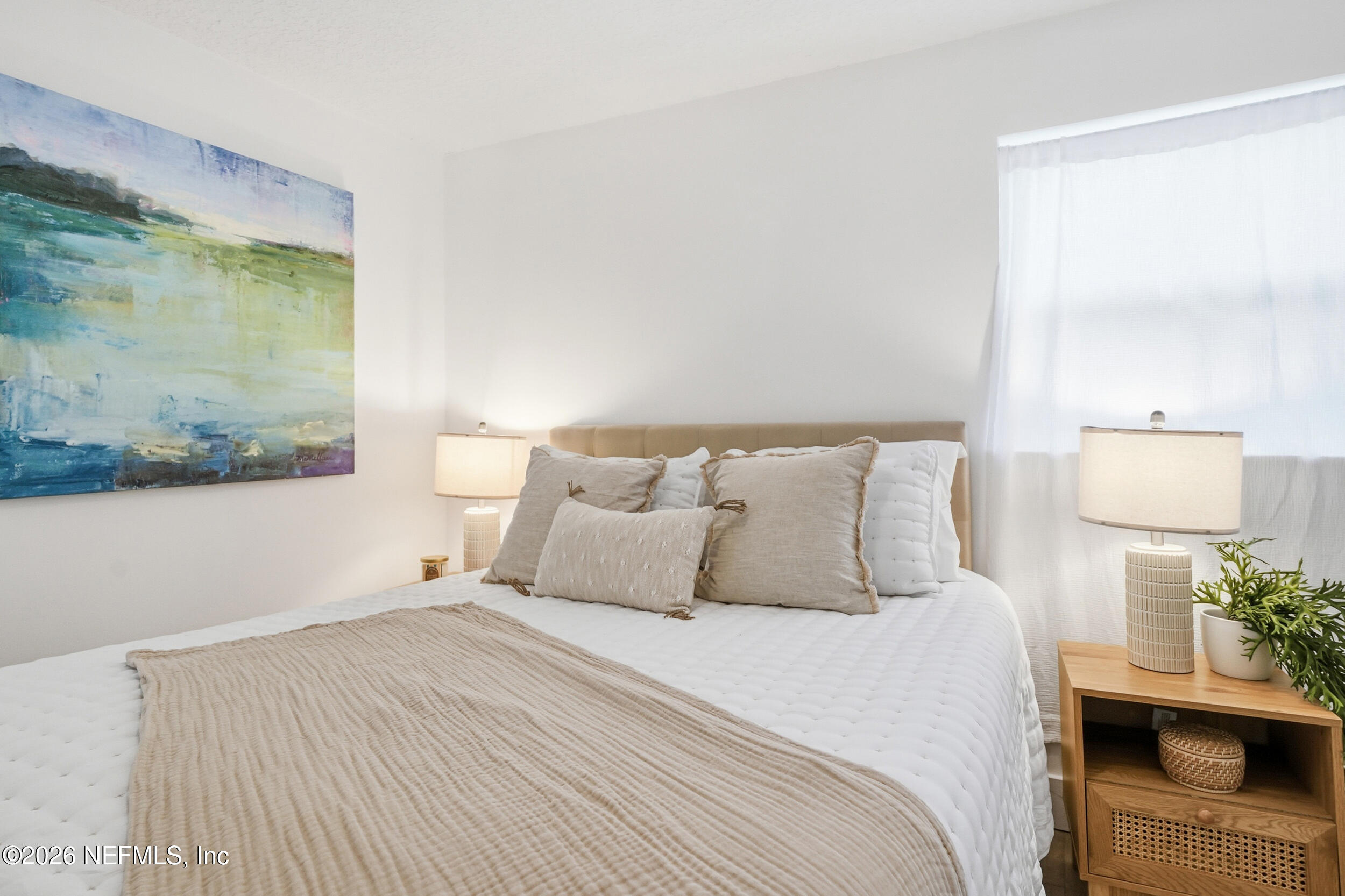 785 Triton Road Atlantic Beach, FL 32233 - Photo 21 of 54 a bedroom with a bed and a painting on the wall