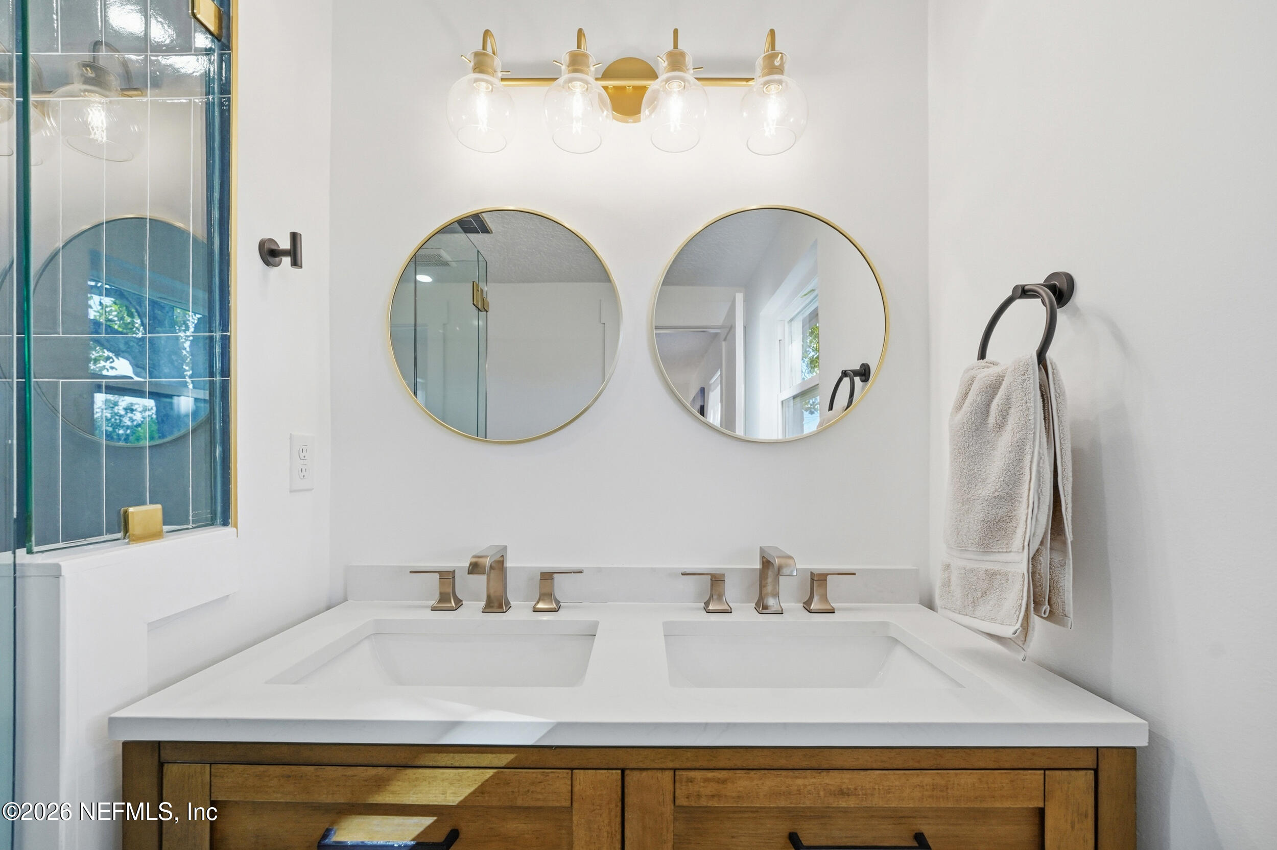785 Triton Road Atlantic Beach, FL 32233 - Photo 23 of 54 a bathroom with a sink and a mirror