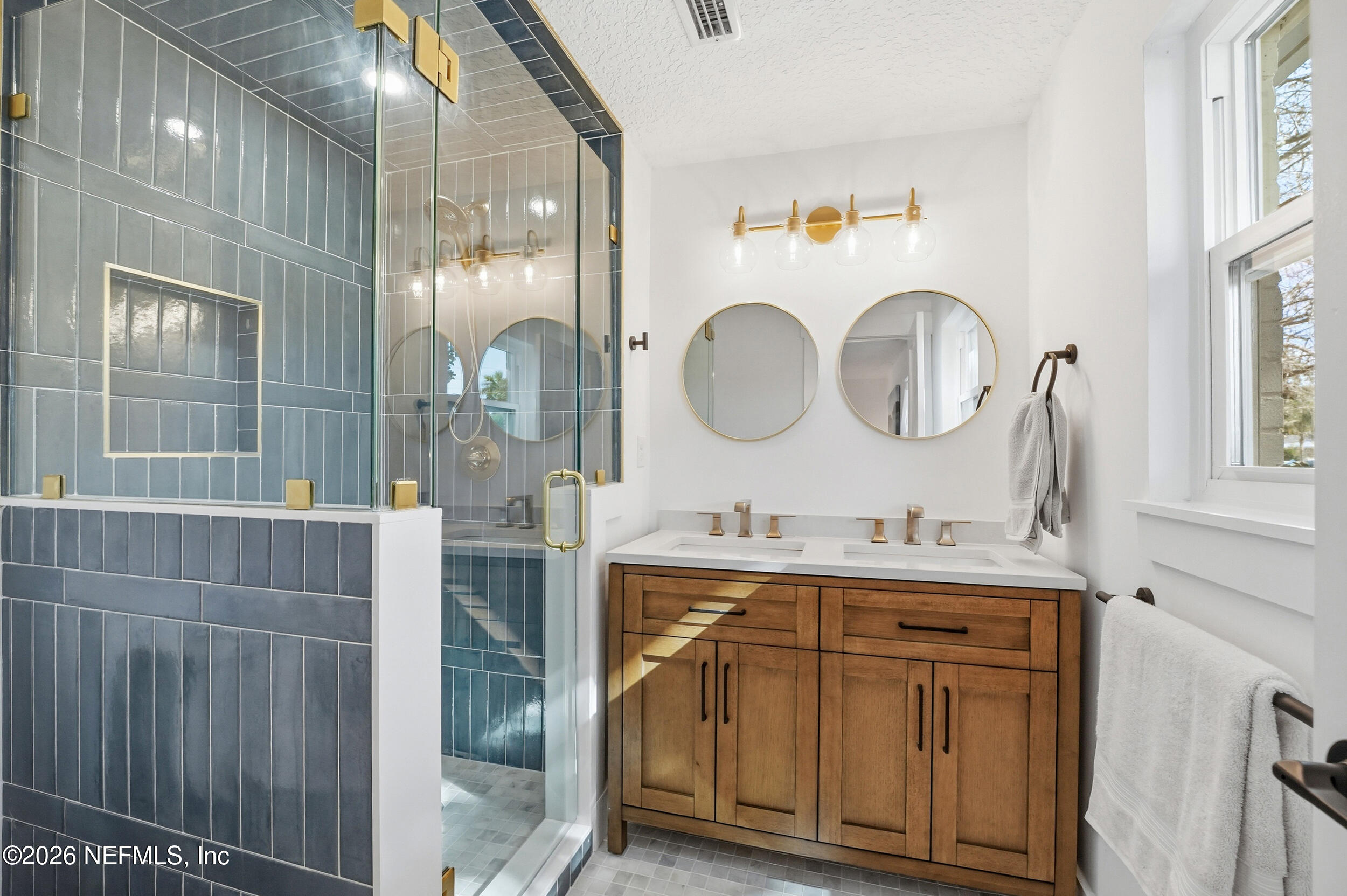 785 Triton Road Atlantic Beach, FL 32233 - Photo 25 of 54 a bathroom with a double vanity sink and a mirror