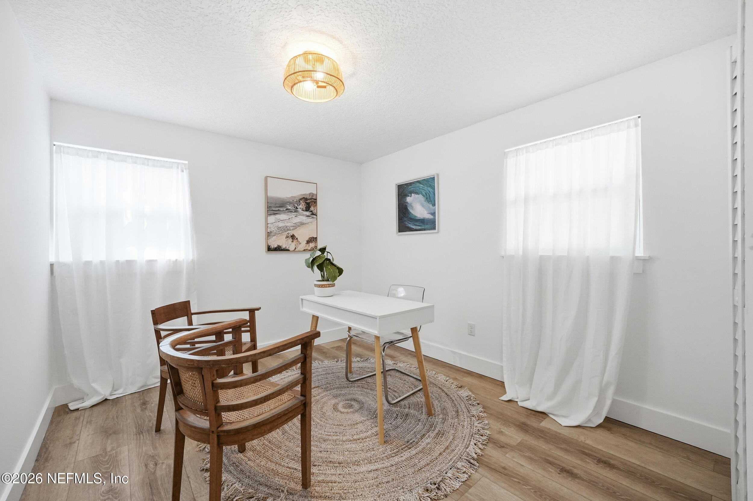 785 Triton Road Atlantic Beach, FL 32233 - Photo 32 of 54 a view of a dining room with a table and chairs