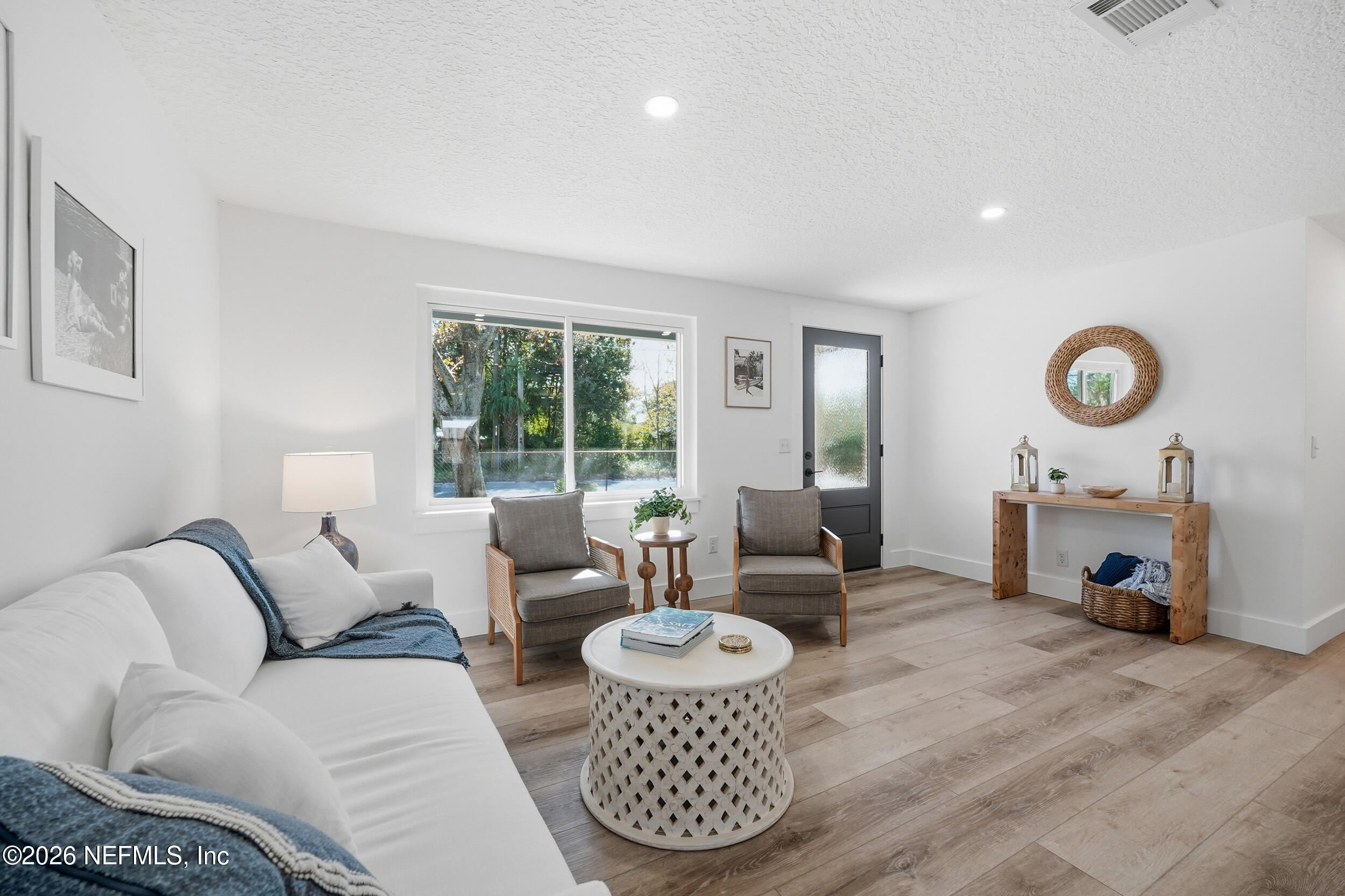 785 Triton Road Atlantic Beach, FL 32233 - Photo 4 of 54 a living room with furniture a fireplace a rug and a window