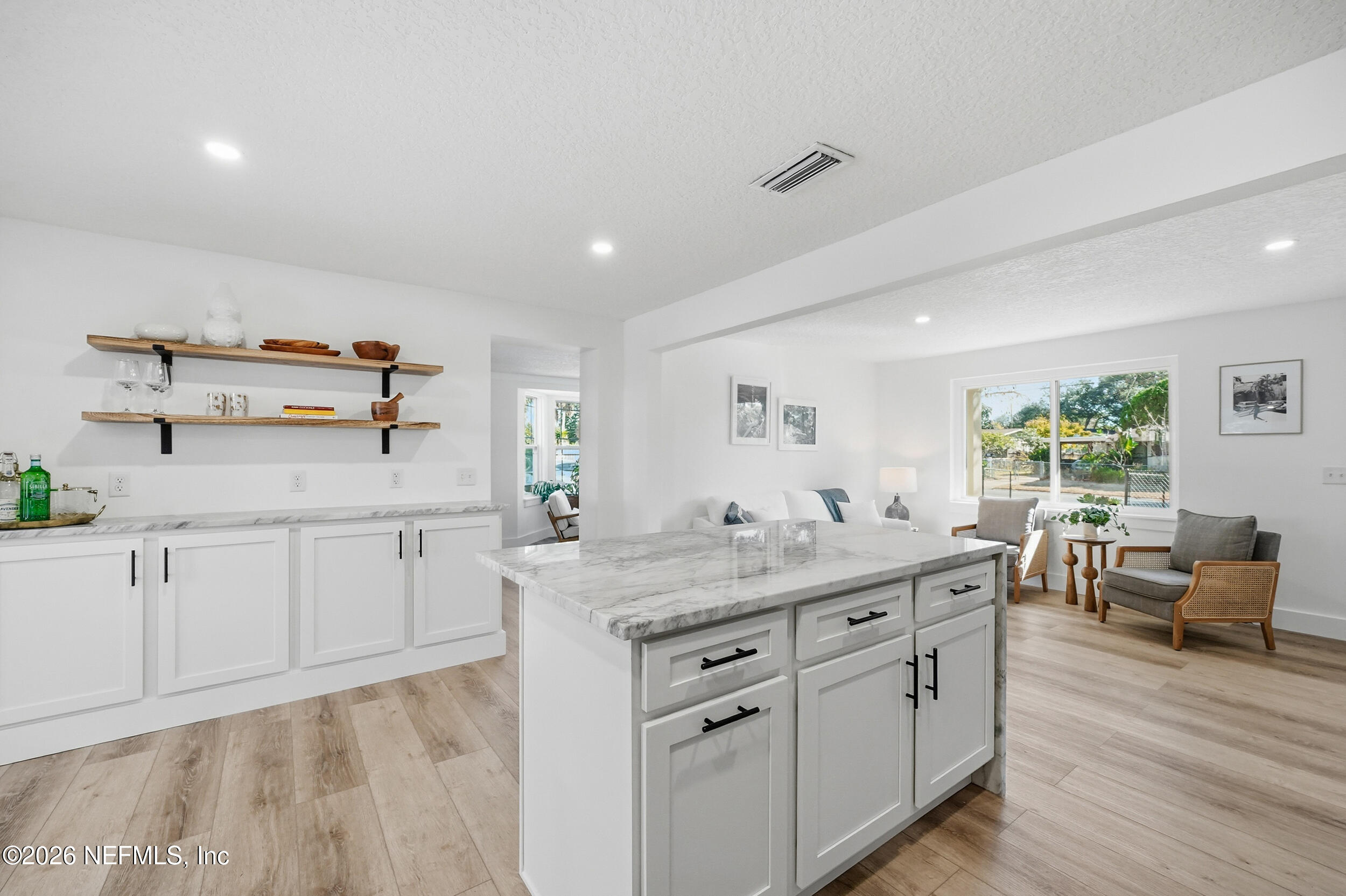 785 Triton Road Atlantic Beach, FL 32233 - Photo 5 of 54 a kitchen with white cabinets and sink