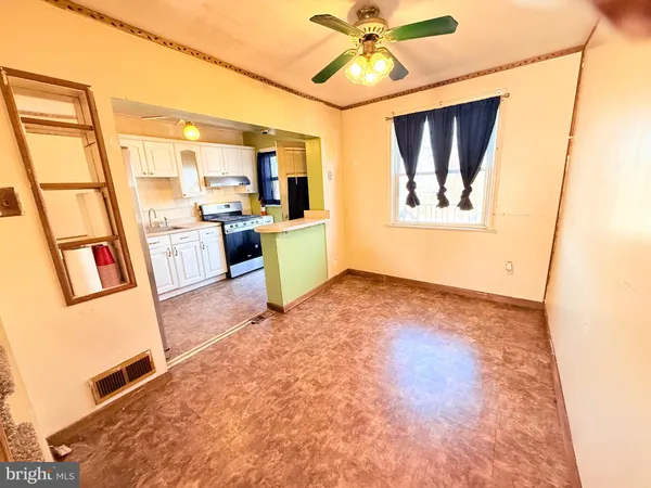 a view of a kitchen with a sink and a window