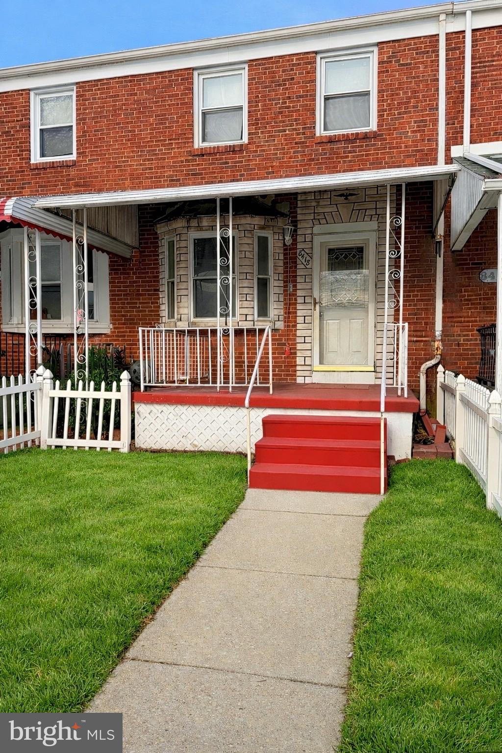 8418 Kavanagh Road Baltimore, MD 21222 - Photo 2 of 24 a front view of a house with a yard