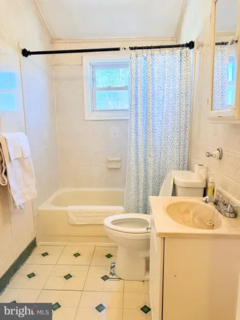 a bathroom with a sink a bathtub and a shower