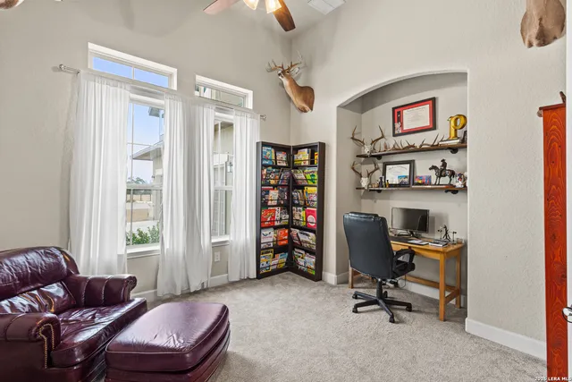 a livingroom with workspace and a couch