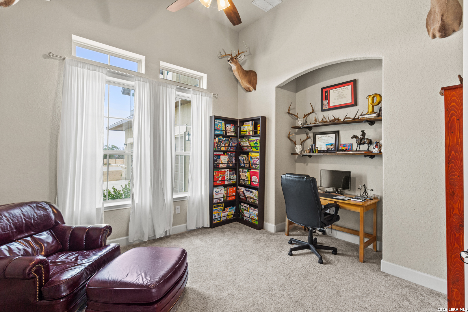 527 James Way Castroville, TX 78009 - Photo 11 of 32 a livingroom with workspace and a couch