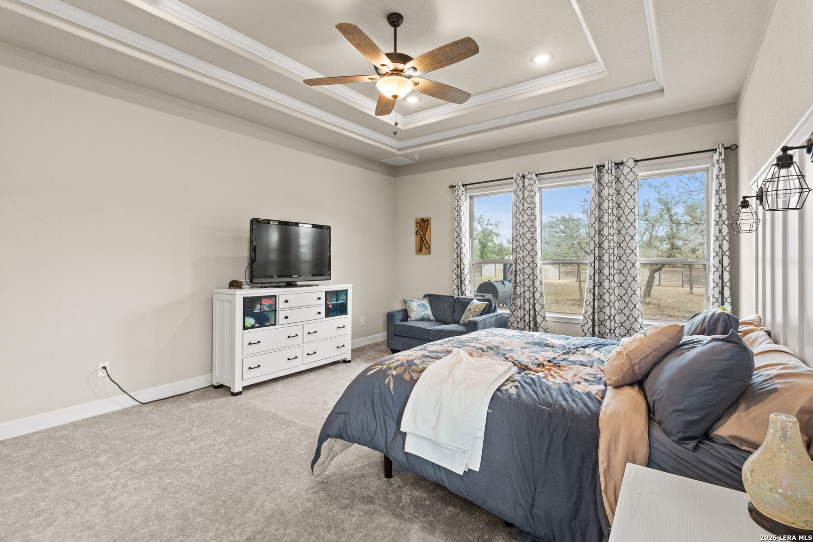 527 James Way Castroville, TX 78009 - Photo 13 of 32 a bedroom with a bed and a flat screen tv