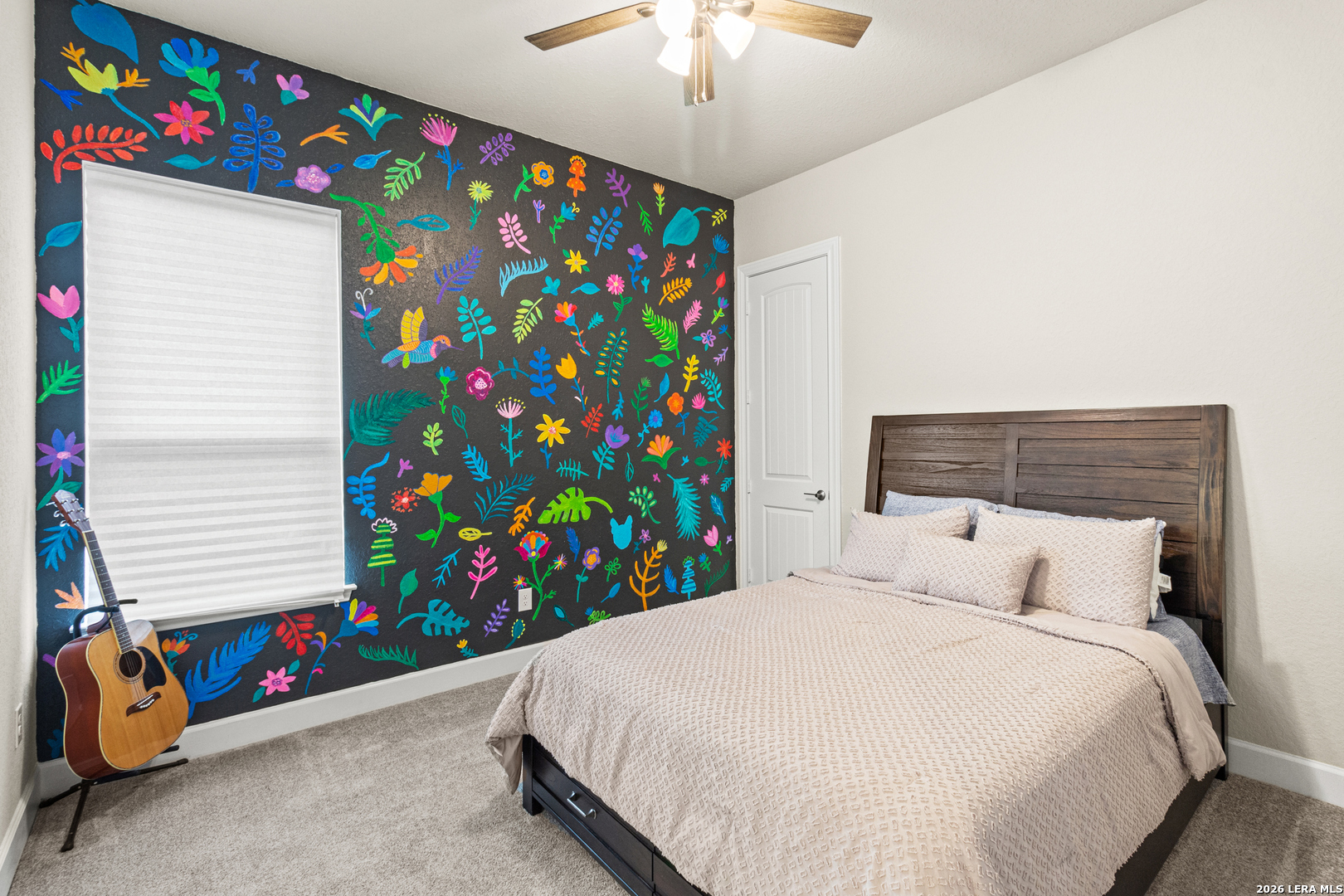 527 James Way Castroville, TX 78009 - Photo 16 of 32 a bedroom with a bed and a window