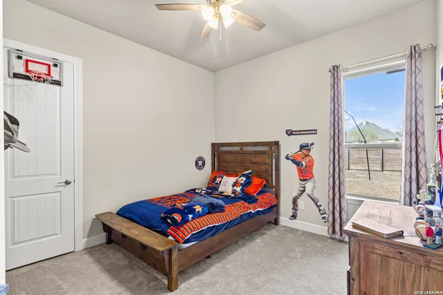 a bedroom with baby bed toys and a baby crib