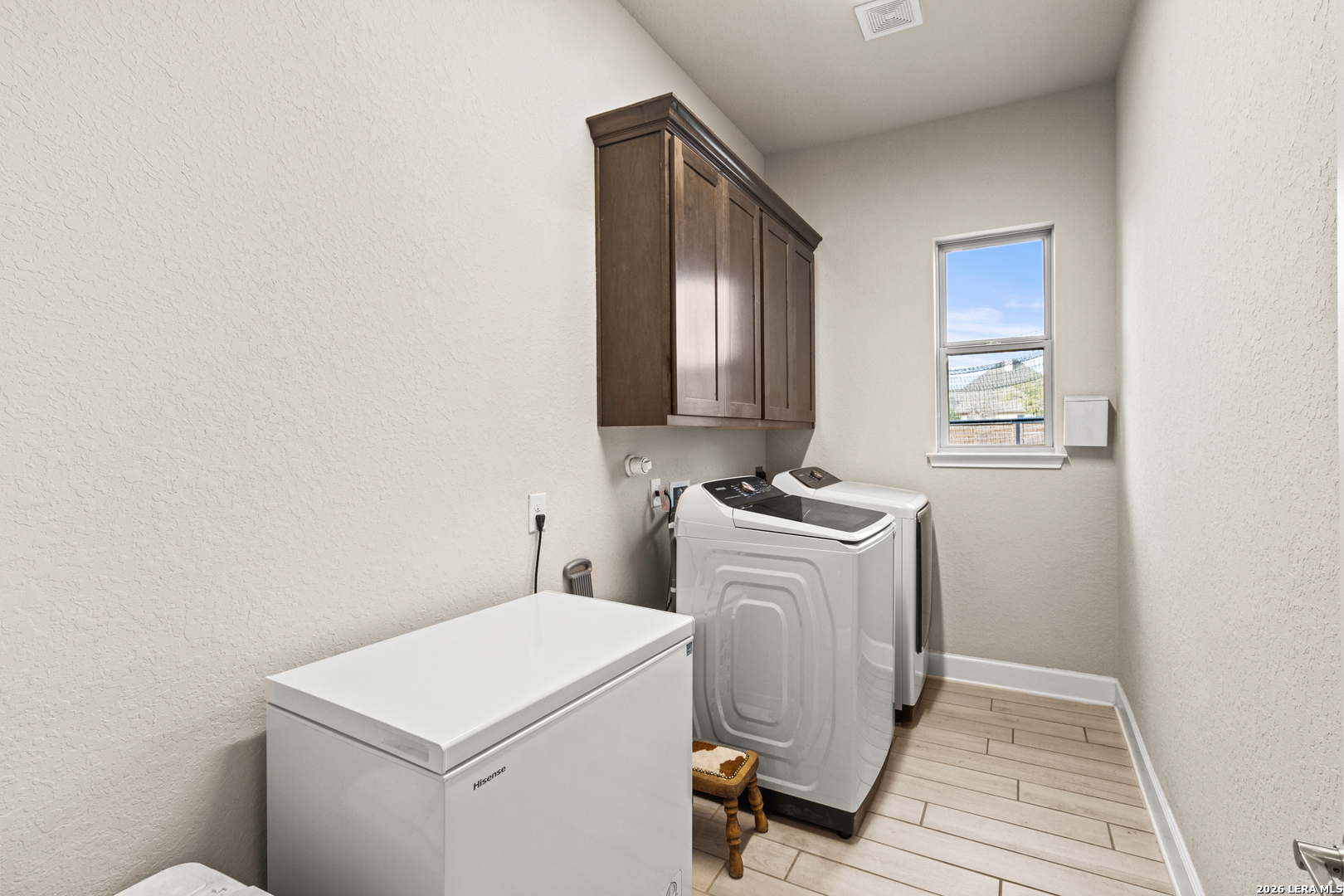 527 James Way Castroville, TX 78009 - Photo 22 of 32 a utility room with dryer and washer