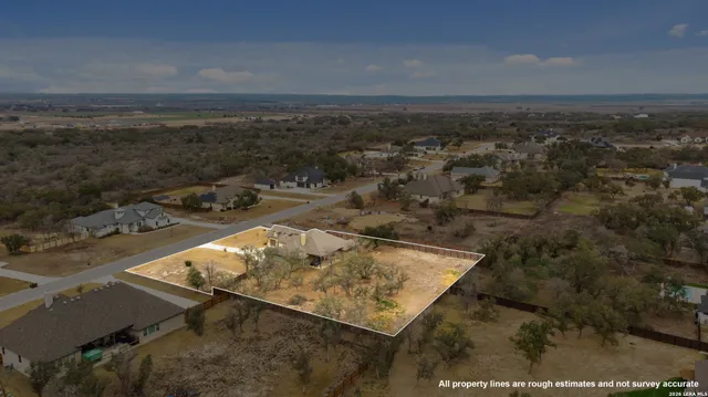 an aerial view of house with yard